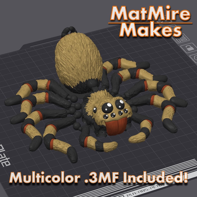May include: A 3D printed model of a cartoon spider with black, orange, and yellow stripes on its legs. The spider has a fuzzy brown body and large, round eyes. The model is printed on a gray platform and the text "MatMire Makes" is visible in the background.