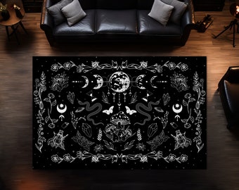 May include: Black and white rug with a moon, stars, flowers, mushrooms, and snakes design. The rug has a white outline and is on a dark wood floor.