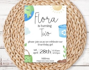 May include: A white invitation card with a green and blue earth illustration, a yellow sun, and a blue recycling bin. The text on the card reads "Flora is turning Two, please join us as we celebrate our birthday girl, sat. april 28th 10:30am-12:00pm, Address, rsvp xxx-xxx-xxxx".