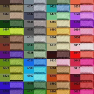 May include: A color chart featuring a grid of various ribbon swatches. Each swatch displays a unique solid color, with corresponding numerical labels. The colors range from vibrant to muted tones, including shades of pink, green, blue, and brown.