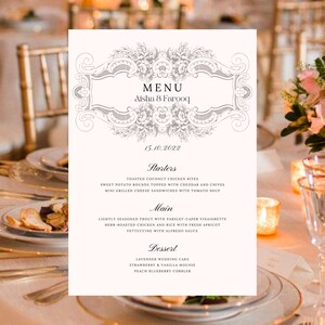 May include: A white wedding menu card with a decorative floral border. The menu includes starters, main course, and dessert options. The text reads "MENU Aisha & Farooq 15.10.2022".