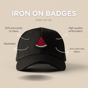 May include: Black baseball cap with a watermelon embroidered patch. The text "IRON ON BADGES" and "HIBR.CO.UK" are printed on the cap. The cap is washable and the embroidery is high quality.