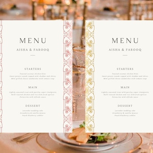 May include: Two wedding menu cards with gold and pink decorative borders. The menus list the starters, main course, and dessert for the wedding reception. The text on the menus reads "MENU" and "AISHA & FAROOQ".