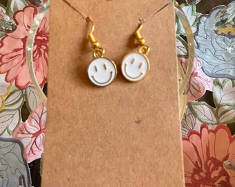 White smiley face earrings