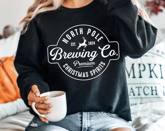 Unisex North Pole Brewing Co. Graphic Tee - Premium Christmas Holiday Spirit Printed T-Shirt in Various Colors | Family Christmas Gift Ideas