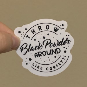 May include: White sticker with black text that reads "Throw Black Powder Around Like Confetti".