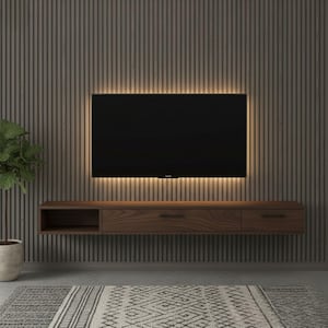 May include: A modern entertainment center with a dark wood floating cabinet, a large black television, and a warm light strip. The wall behind the TV has vertical wood paneling. A potted plant and patterned rug complete the room.
