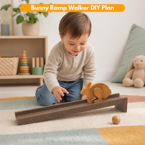 May include: A wooden bunny ramp walker toy featuring a brown rabbit figure on a long, narrow, dark brown wooden ramp. The text Bunny Ramp Walker DIY Plan is displayed at the top of the image. A small wooden ball sits on the floor near the ramp.