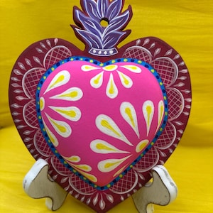 May include: A set of three ceramic mugs with a speckled, matte finish. The mugs are in shades of cream, light brown, and dark brown. Each mug has a simple, minimalist design, perfect for coffee or tea.