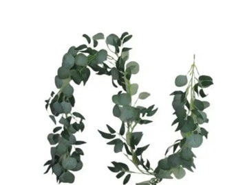 May include: A long garland of artificial eucalyptus leaves, perfect for adding a touch of greenery to your home decor.