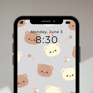 May include: A smartphone displays a cute wallpaper featuring repeating illustrations of brown and cream-colored bear faces. The background is light gray with small pink hearts and stars. The time is 8:30 on Monday, June 3.