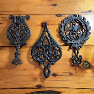 Mid-Century Wilton Cast Iron Trivets