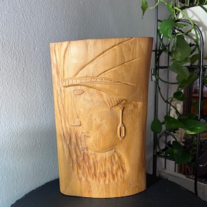 Hand carved artist signed indigenous wooden wall hanging