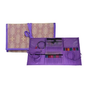 May include: A purple knitting needle set with various sizes and colors, neatly organized in a matching case. The case is open, revealing the needles and accessories. A patterned fabric case is also visible.