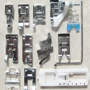May include: A collection of 12 silver sewing machine presser feet, including a zipper foot, a blind stitch foot, a buttonhole foot, and a walking foot. The feet are arranged on a light gray fabric background.