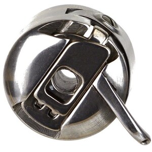 May include: A silver bobbin winder with a lever on the side. The winder is used to wind thread onto a bobbin for sewing machines.