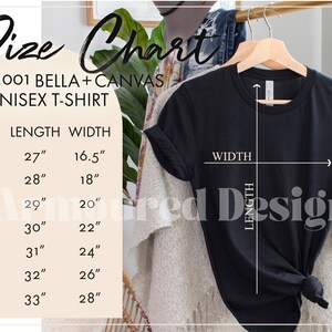 K&ouml;nnte beinhalten: Schwarzes Unisex-T-Shirt, das an einem Holzb&uuml;gel h&auml;ngt, mit einer Gr&ouml;&szlig;entabelle. Die Tabelle listet die Gr&ouml;&szlig;en XS bis 3X auf, mit L&auml;ngen von 68,6 cm bis 83,8 cm und Breiten von 41,9 cm bis 71,1 cm. Der Text "3001 BELLA+CANVAS UNISEX T-SHIRT" ist ebenfalls sichtbar.