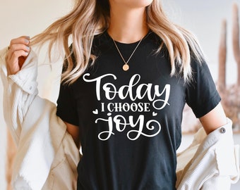 May include: Black t-shirt with white text that reads "Today I Choose Joy" with a heart on either side of the word "choose".