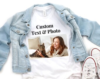 May include: White t-shirt with the text "Custom Text & Photo" printed on the front. A photo of a woman and a cat is printed below the text.