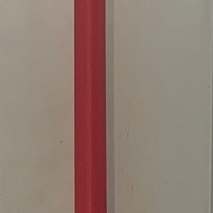 May include: A long, thin, red, cylindrical object. It is made of multiple stacked pieces.