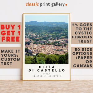 May include: A framed print of Città di Castello, Italy, featuring a scenic aerial view of the town with red-tiled roofs and green hills. The print includes the town's name, coordinates, and the text "classic print gallery."