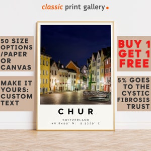 May include: A framed print featuring a nighttime view of Chur, Switzerland, with colorful buildings and a cobblestone square. The print includes the city's name and coordinates. The text "classic print gallery" is at the top.