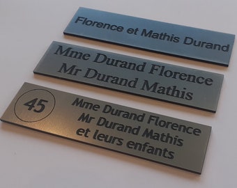 Adhesive mailbox plate