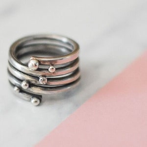 Spiral ring made of silver with small soldered silver balls, winding ring fivefold with balls