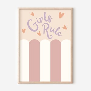 May include: A pink and white striped print with the text "Girls Rule" in purple lettering and orange hearts.