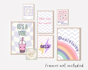 May include: A collection of framed art prints with a pastel color palette. The prints feature various designs, including a checkerboard pattern with a boba drink, a floral design, a rainbow, and text that reads "It's a Vibe", "Who runs the world?", "Girls!", and "Positivity".