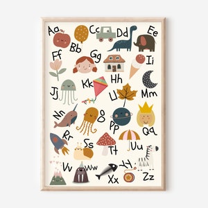 May include: A framed alphabet art print featuring colorful illustrations for each letter. The artwork includes an apple, balloon, car, dinosaur, elephant, flower, girl, house, ice cream, moon, jellyfish, kite, leaf, narwhal, octopus, planet, princess, rocket, snail, mushroom, umbrella, zebra, and more.