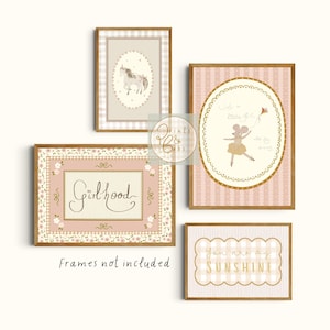 May include: A collection of framed art prints with a whimsical theme. The prints feature a unicorn, a mouse with a kite, the word "Girlhood", and the phrase "You are my sunshine". The frames have a gold border and the prints have a soft, pastel color palette.