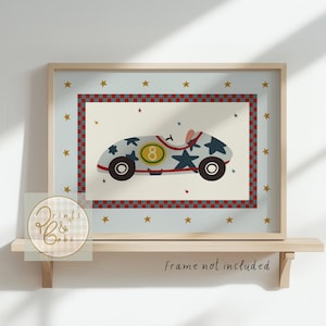May include: A framed print featuring a vintage race car illustration. The car is light blue with dark blue star accents and the number 8. The print has a light blue background with gold stars and a red and white checkered border. The text "Frame not included" is visible.