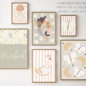 May include: Set of eight printable nursery art prints featuring a variety of whimsical designs, including mermaids, butterflies, moons, and a swan. The prints are in a muted color palette of pink, yellow, and blue. The prints are perfect for a child's bedroom or playroom.