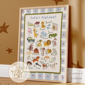 May include: A framed poster titled Safari Alphabet featuring illustrations of animals and objects for each letter from A to Z. The design includes a light blue and white striped border with red star accents, set against a cream background.