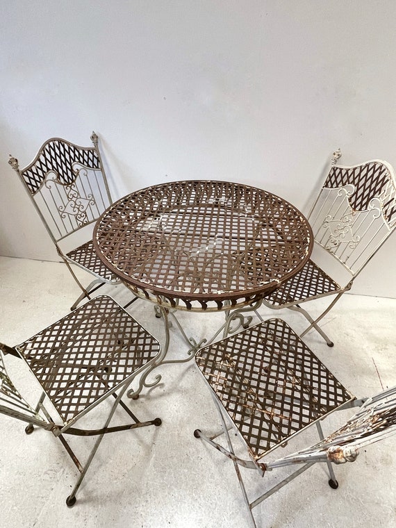Antique wrought iron bistro set discount