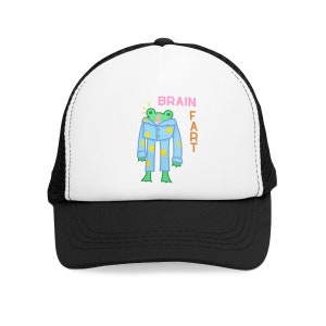 May include: A black and white trucker hat with a white front panel featuring a cartoon frog wearing blue pyjamas with yellow stars. The text "BRAIN FART" is printed vertically on the right side of the frog.