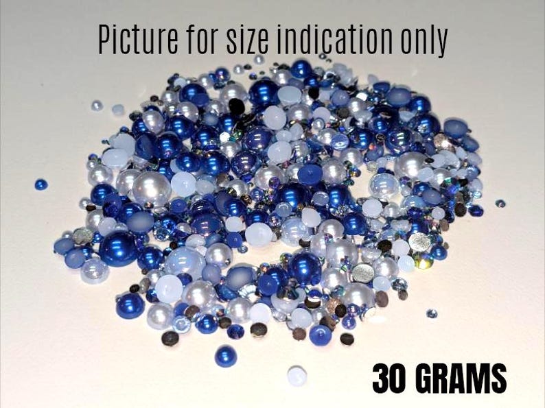 May include: A close-up of a mix of blue and white beads, including pearls, for crafting. The image shows 30 grams of beads. Picture for size indication only.