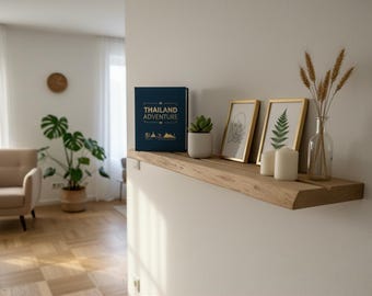 Wall shelf made of solid oak with book groove – as a floating shelf – optionally with natural edge or straight edge.