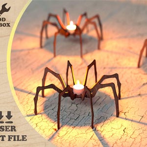 May include: Wooden spider candle holders with tea lights, laser cut from wood. The Wood Toolbox logo is in the upper left corner. The words "LASER CUT FILE" are in the lower left corner.