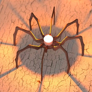 Peut inclure: Un bougeoir d&eacute;coratif en forme d'araign&eacute;e. L'araign&eacute;e m&eacute;tallique a huit pattes et un corps circulaire qui maintient une bougie blanche. Le bougeoir est marron avec une lueur chaude, projetant des ombres sur la surface textur&eacute;e.