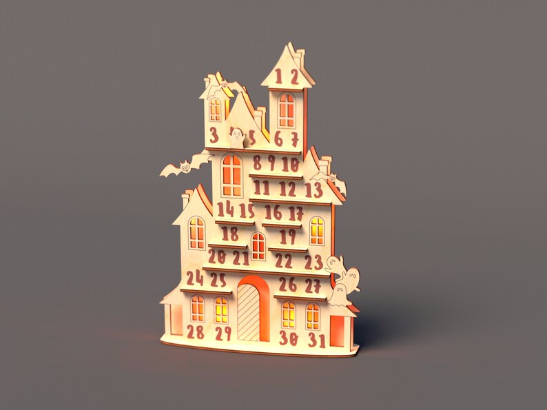 May include: A wooden Halloween advent calendar shaped like a haunted house with 31 numbered doors. The house has a tower, windows, and a door. There are ghosts and bats on the house.