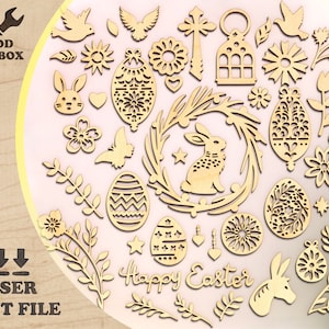 May include: A set of laser cut wood shapes for crafting projects. The shapes include a bunny rabbit, flowers, eggs, a wreath, a cross, a lantern, and the words "Happy Easter".