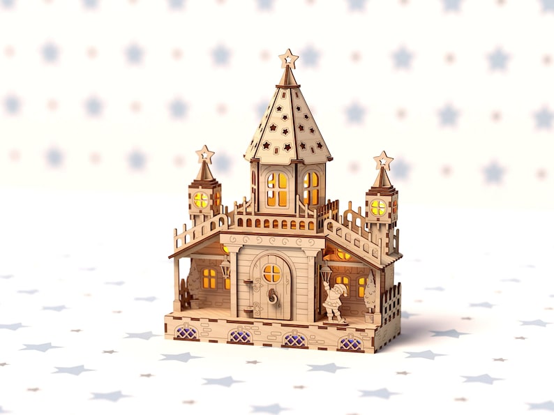 May include: A wooden model of a fairytale castle with a star on top, lit with warm white lights. The castle has a porch with a small figure standing in the doorway.