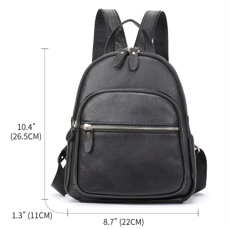 May include: Black leather backpack with silver zippers and hardware. The backpack measures 10.4 inches tall, 8.7 inches wide, and 1.3 inches deep.