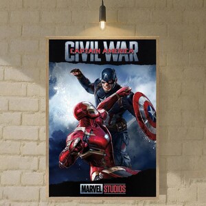 May include: A framed poster featuring Captain America and Iron Man from Marvel's Civil War. Captain America is in a blue and red suit, holding his shield. Iron Man is in a red and gold suit. The poster has the text "CIVIL WAR" and "MARVEL STUDIOS".