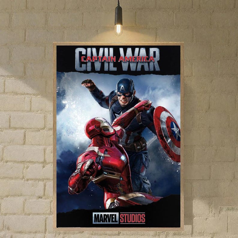 May include: A framed poster featuring Captain America and Iron Man from Marvel's Civil War. Captain America is in a blue and red suit, holding his shield. Iron Man is in a red and gold suit. The poster has the text "CIVIL WAR" and "MARVEL STUDIOS".