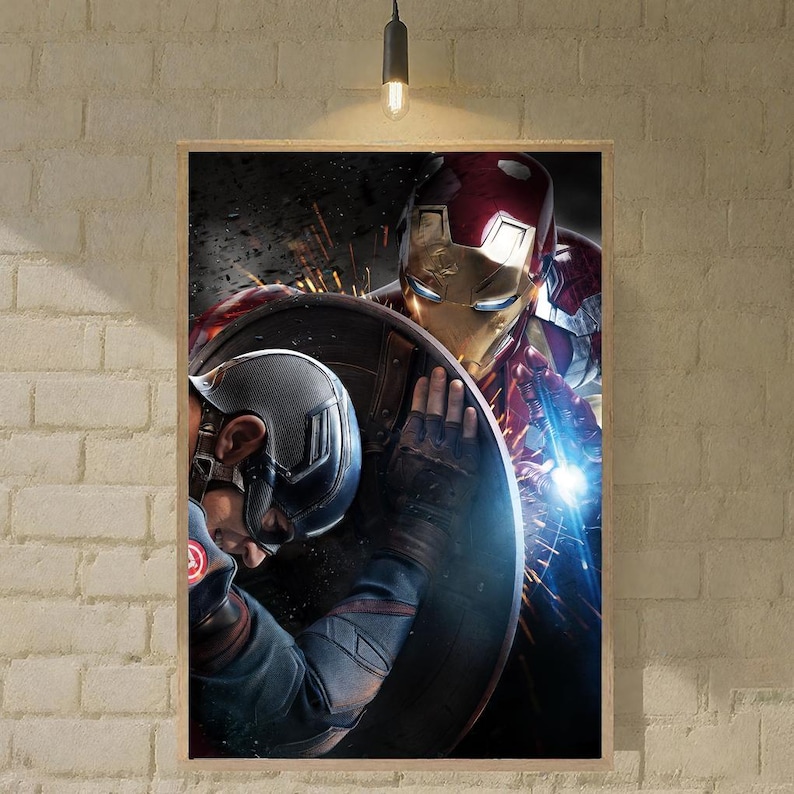 May include: Framed print featuring Iron Man and Captain America. Iron Man, in a red and gold suit, is positioned behind Captain America, who is holding his shield. The artwork has a dark, action-oriented theme.