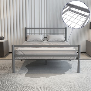 May include: A grey metal bed frame with a slatted headboard and footboard. The bed frame has a metal slat support system.