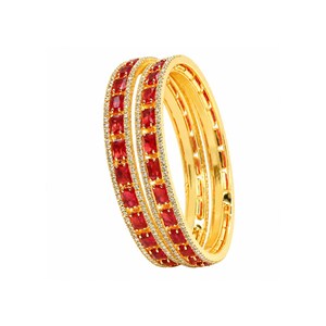 May include: Two gold bangles featuring a central row of rectangular red gemstones. Each bangle is bordered by two thin rows of small, clear white stones. The gold metal has a polished finish, and the design is consistent across both circular pieces.
